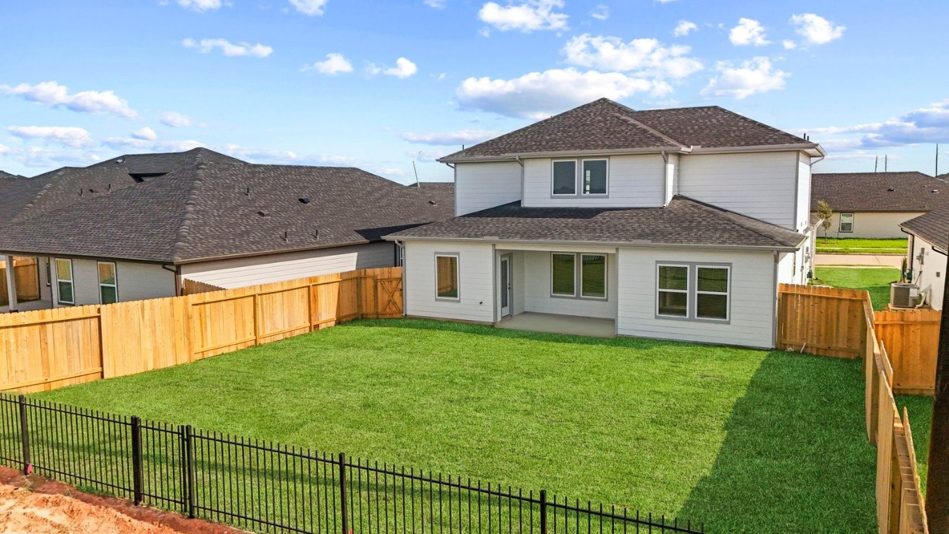 6324 Cherry Mdws Street Rosenberg, TX 77469 - Photo 25 of 41 a front view of a house with a yard