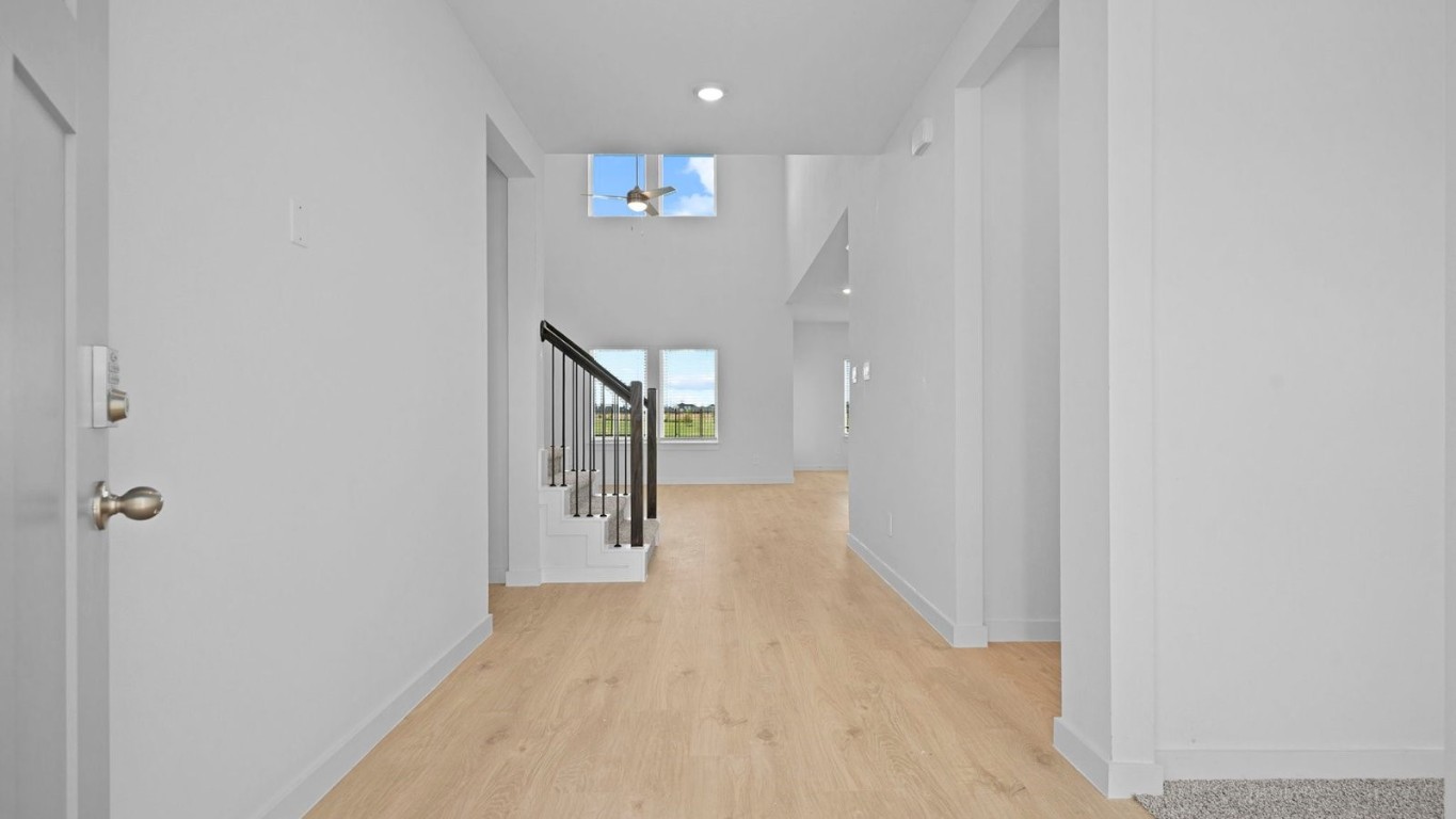 6324 Cherry Mdws Street Rosenberg, TX 77469 - Photo 3 of 41 a view of a hallway with wooden floor