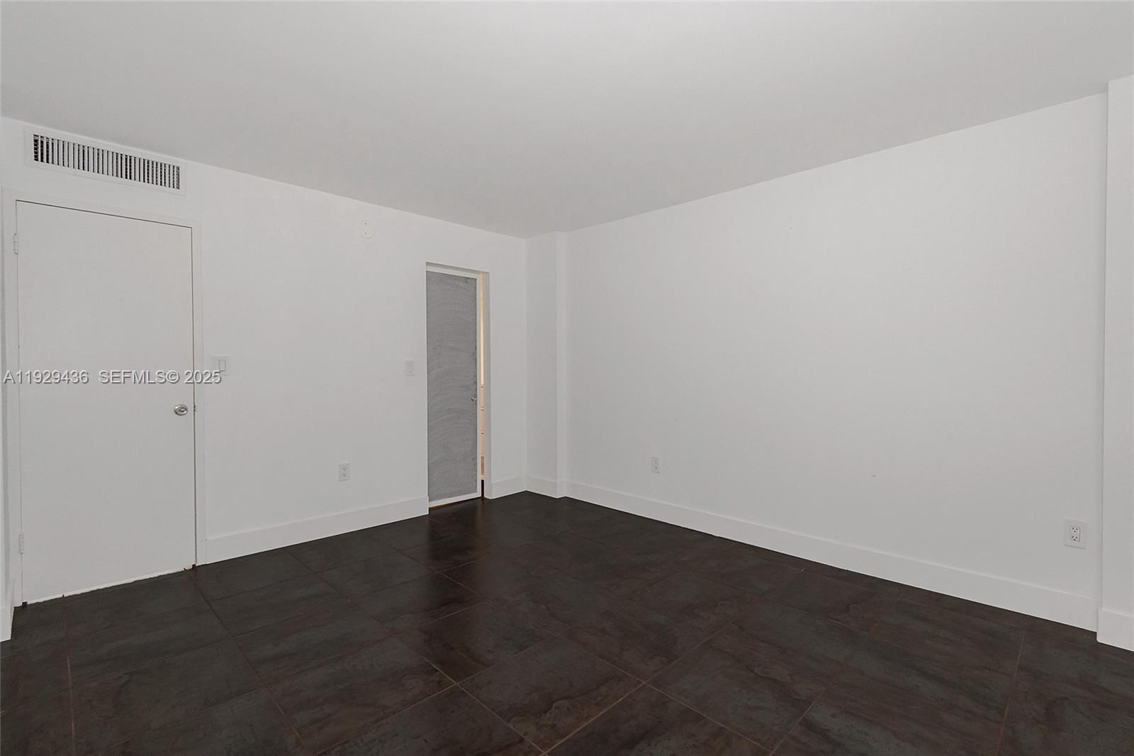 150 Southeast 25th Road, Unit 7J Miami, FL 33129 - Photo 21 of 29 a view of an empty room with wooden floor