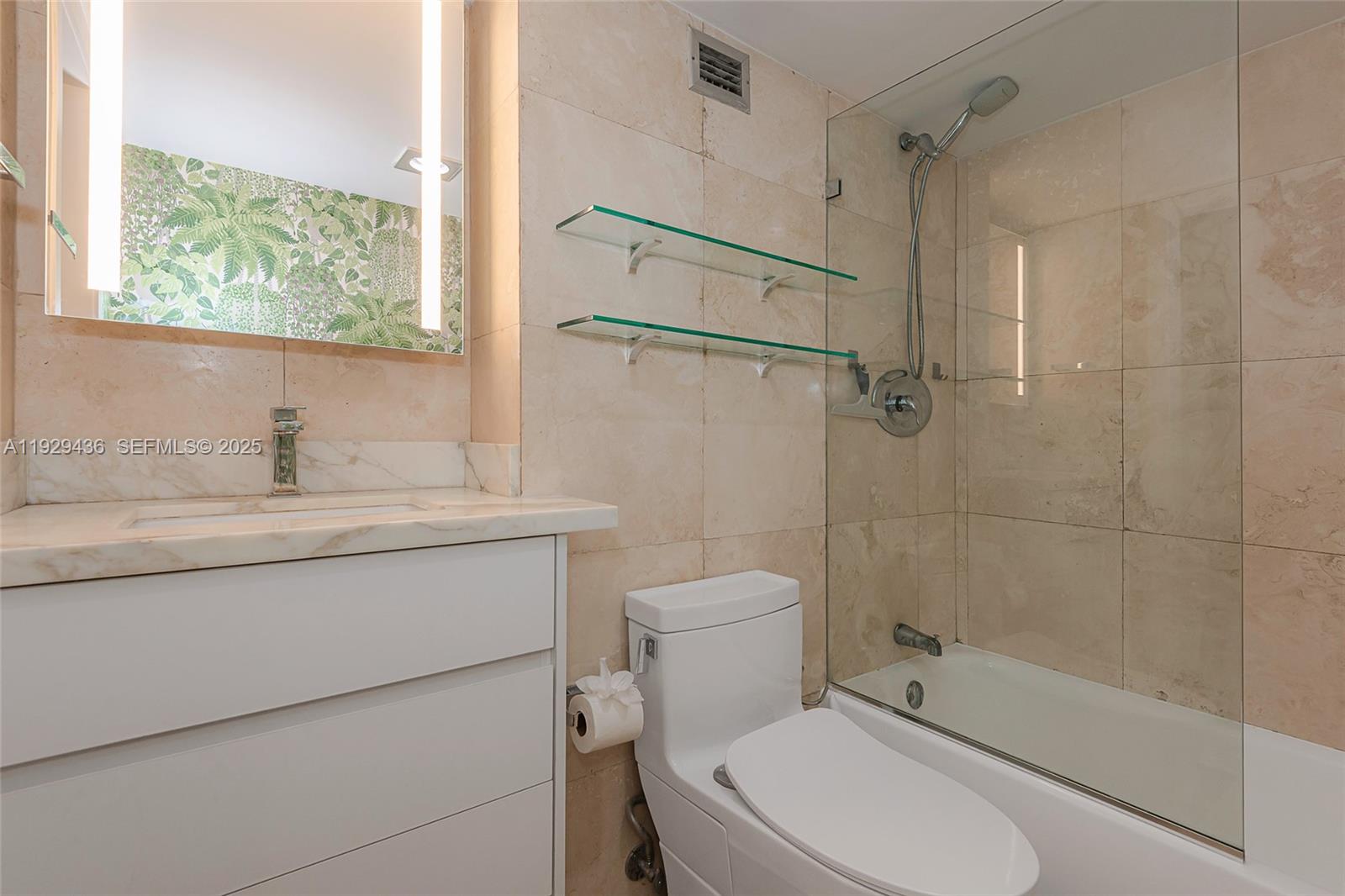 150 Southeast 25th Road, Unit 7J Miami, FL 33129 - Photo 24 of 29 a bathroom with a granite countertop sink toilet and shower