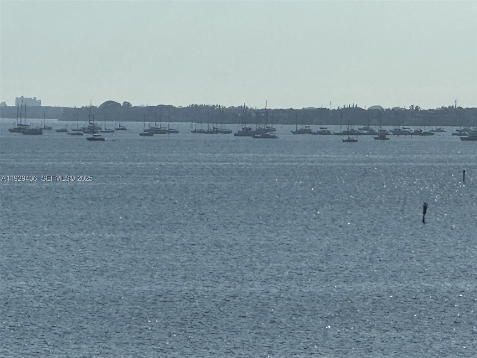 150 Southeast 25th Road, Unit 7J Miami, FL 33129 - Photo 29 of 29 a view of a field with trees in background