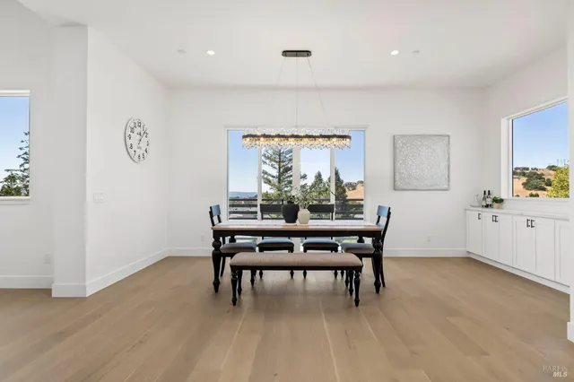 a kitchen with stainless steel appliances white cabinets and a stove