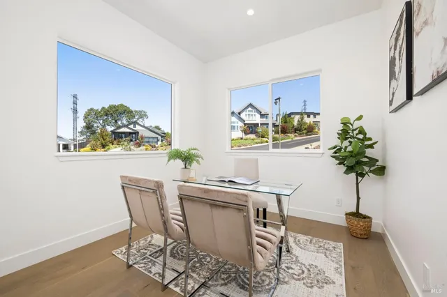 a living room with furniture and stairs