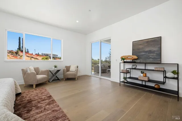 a bathroom with double vanity sink a two mirror a window and a mirror