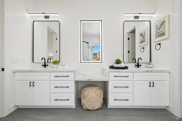 a living room with furniture and stairs