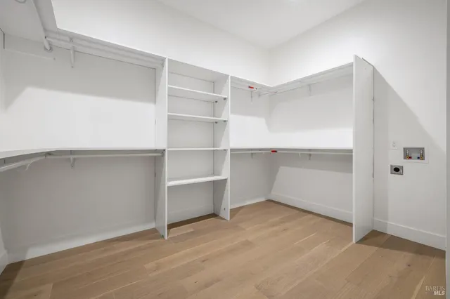 an empty room with a painting on the wall