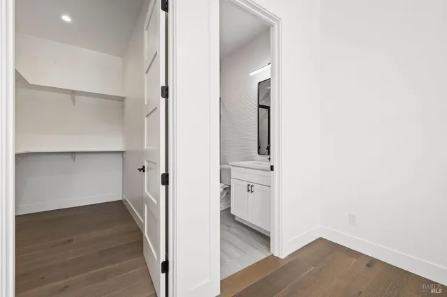 a spacious bedroom with a bed and a couch