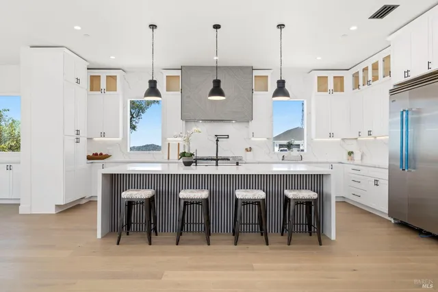 a view of kitchen with furniture and wooden floor