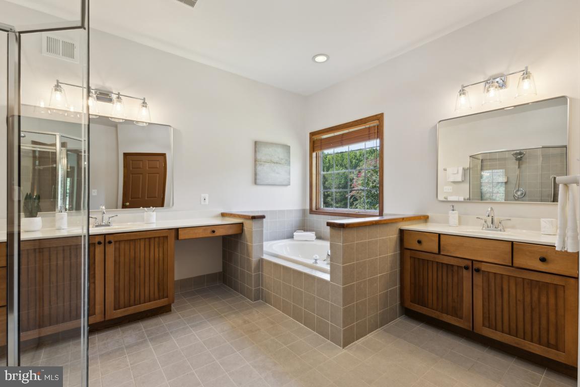 11504 Yates Ford Road Clifton, VA 20124 - Photo 31 of 64 Dual vanities, Jacuzzi soaking tub and shower.