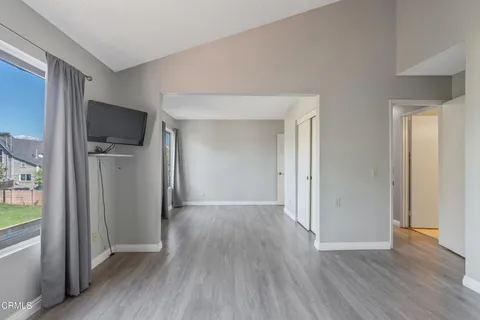 a view of hallway with wooden floor