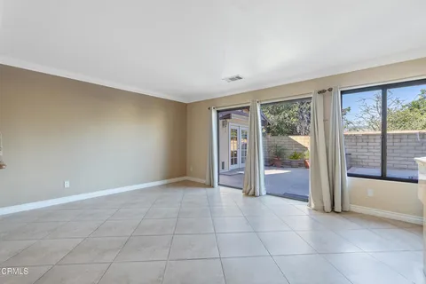 an entryway and livingroom with furniture