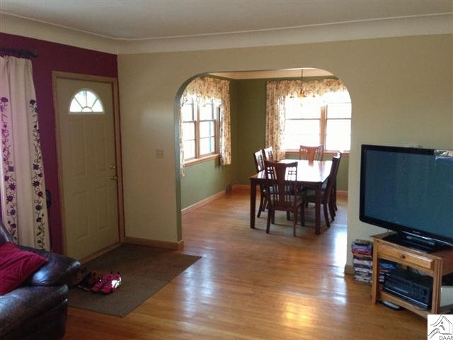 3465 Pioneer Road Barnum, MN 55707 - Photo 7 of 17 View of living room with dining room in background.