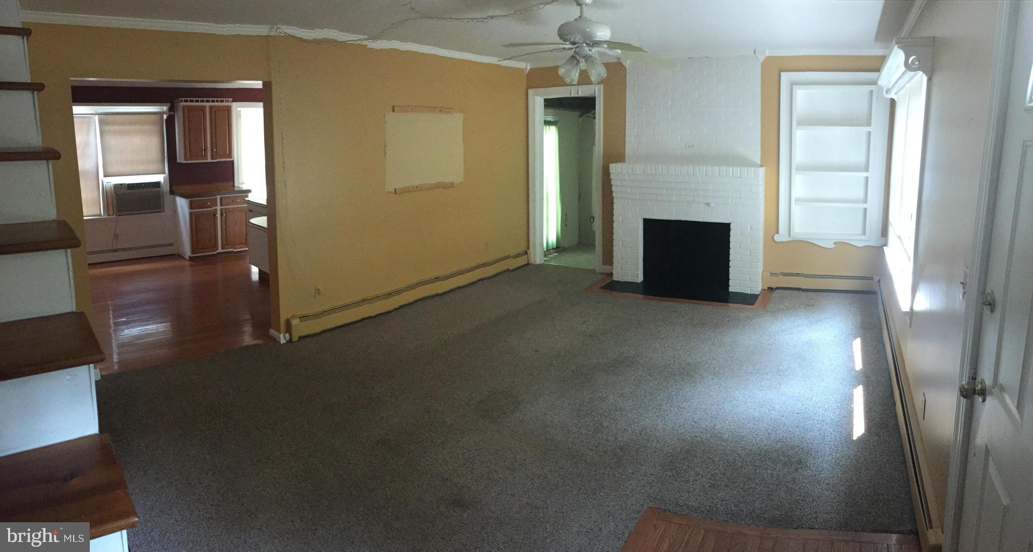 9395 Legion Road Denton, MD 21629 - Photo 7 of 21 wooden floor and a fireplace in a room