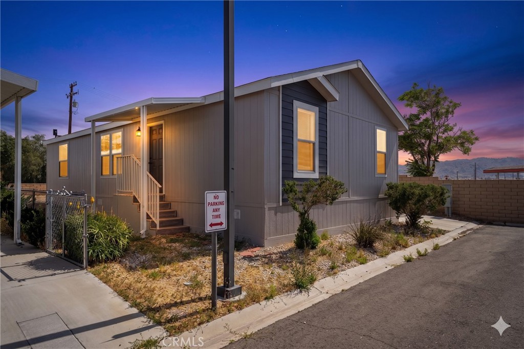 20843 Waalew Road, Unit C125 Apple Valley, CA 92307 - Photo 2 of 38 a front view of a house with garden