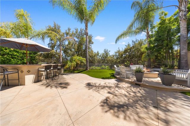a view of a chairs and table in patio