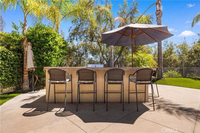 a view of balcony with wooden floor and outdoor seating
