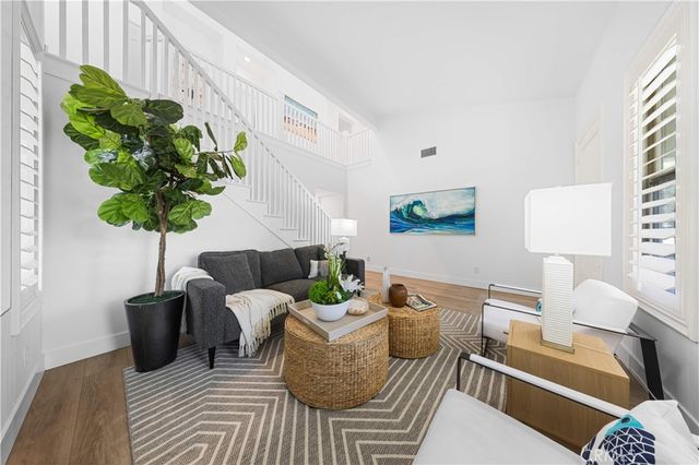 a living room with furniture flowerpot and a potted plant