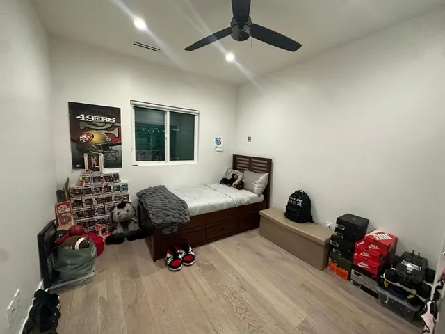 a bedroom with furniture and a window