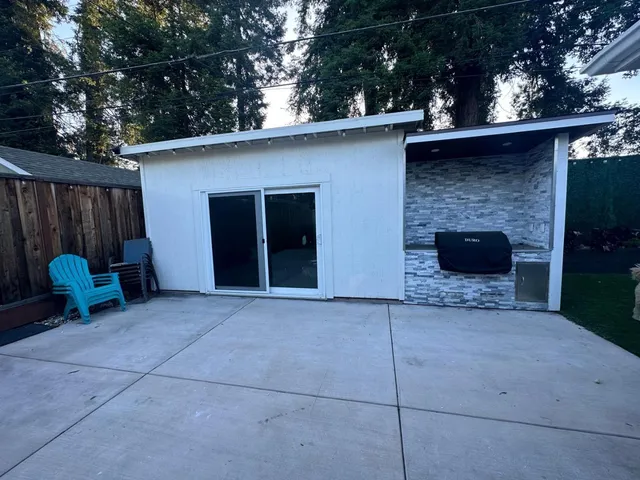 a view of a two chairs in the patio