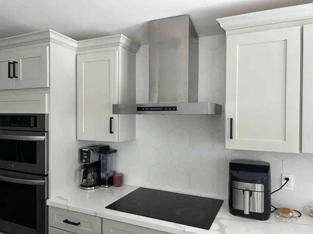 a kitchen with appliances cabinets and a counter top space