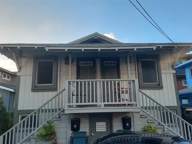 a view of a house with wooden deck