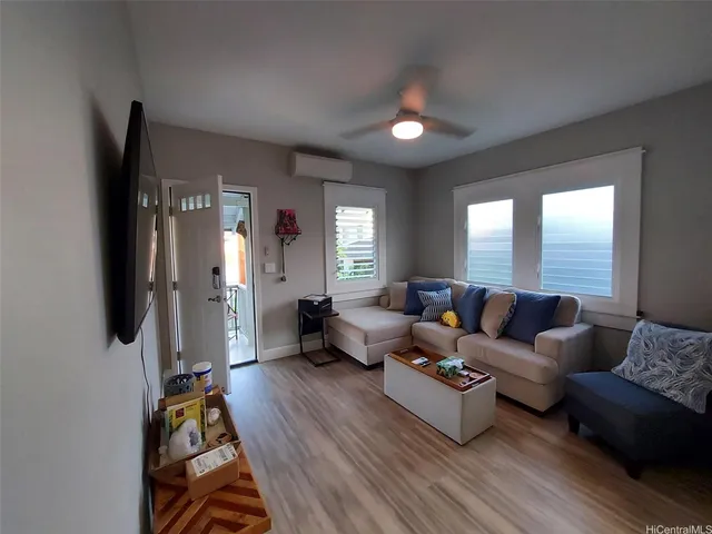 a living room with furniture and a large window