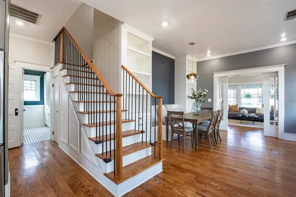 a view of a livingroom with furniture and hardwood floor