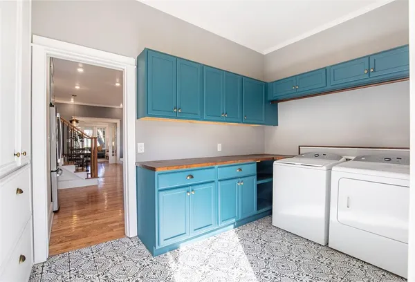 a kitchen with a refrigerator and cabinets
