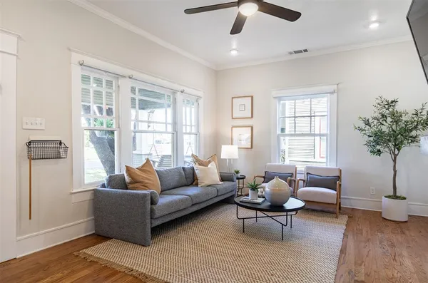 a living room with furniture and windows