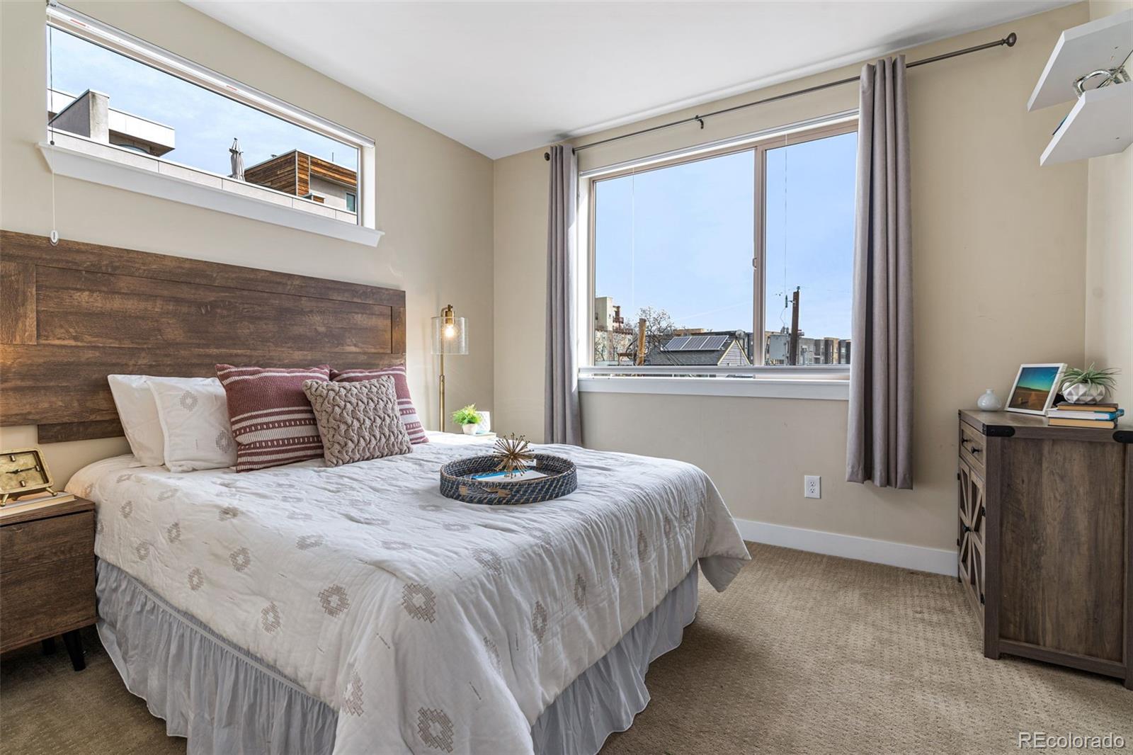 2146 Decatur Street Denver, CO 80211 - Photo 11 of 21 a bedroom with a bed and a large window