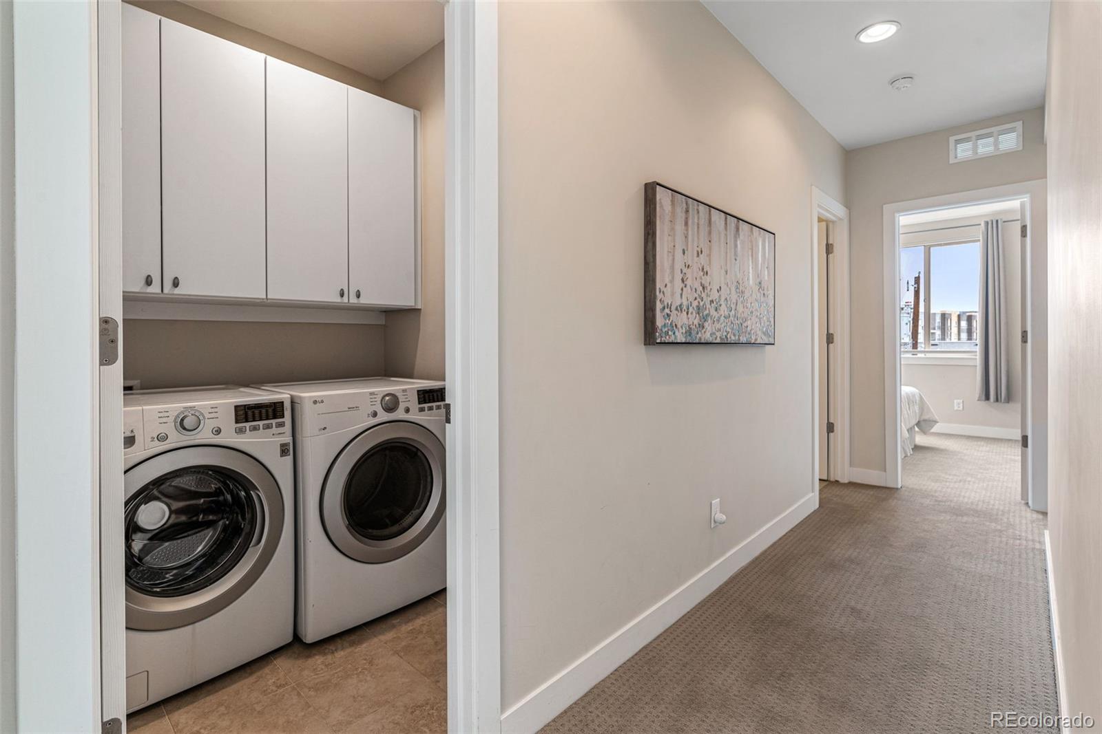 2146 Decatur Street Denver, CO 80211 - Photo 14 of 21 a view of a hallway with washer and dryer