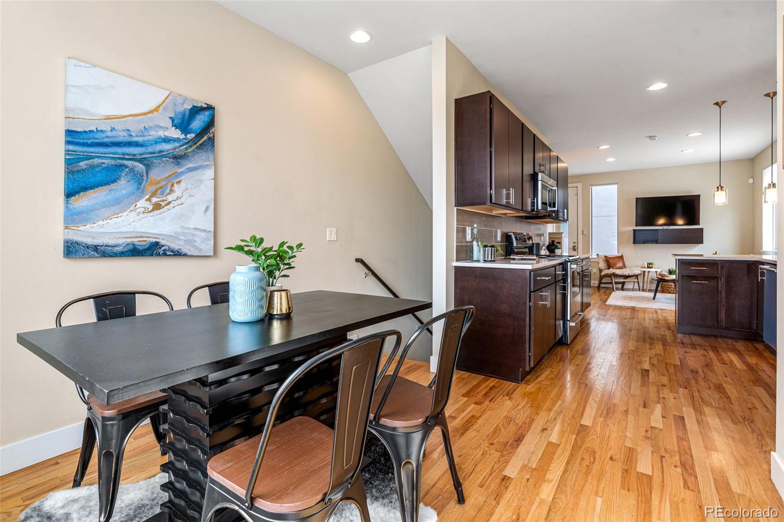 2146 Decatur Street Denver, CO 80211 - Photo 4 of 21 a view of a dining room with furniture and a kitchen
