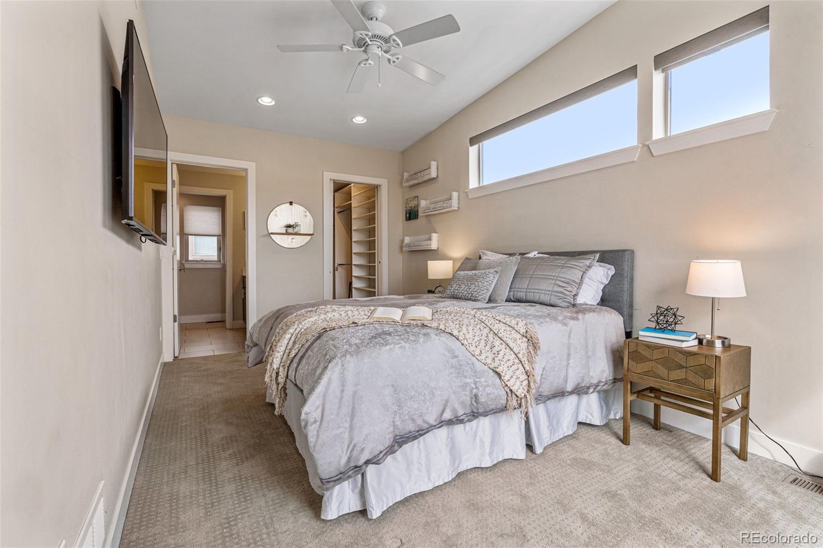 2146 Decatur Street Denver, CO 80211 - Photo 7 of 21 a bedroom with a bed and a lamp