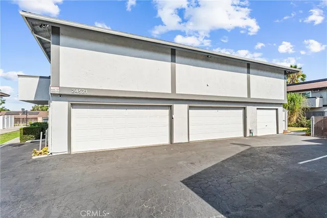 a front view of a house with a garage