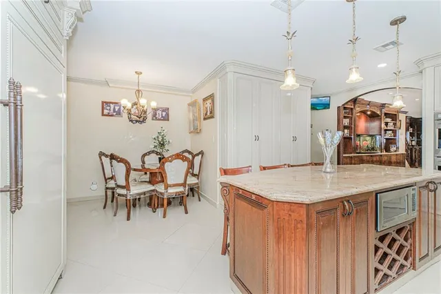 a large kitchen with a table and chairs
