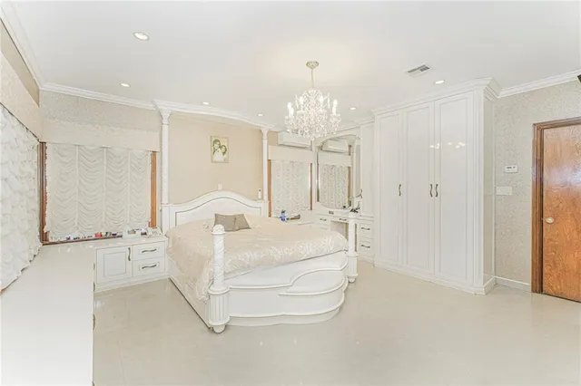 a large white room with a chandelier