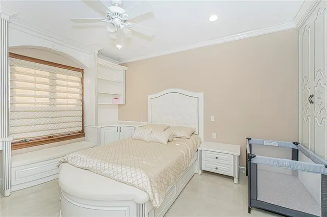 a bedroom with a bed and a couch