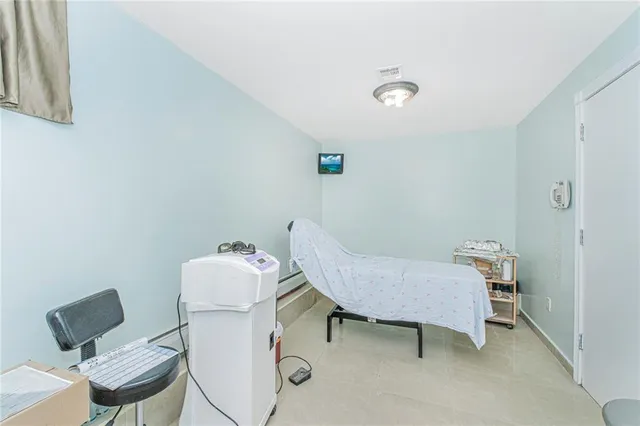 a living room with furniture and a chair