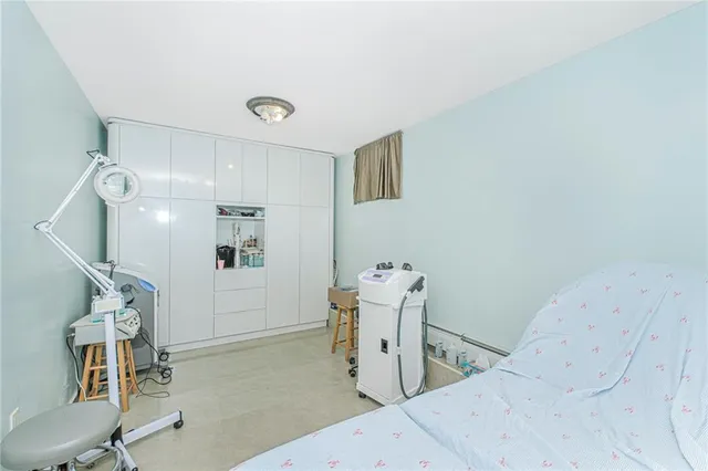 a bedroom with a bed and cabinets