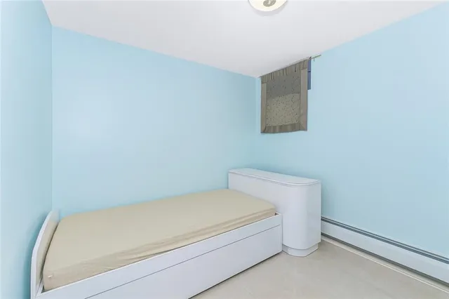 a utility room with a wooden floor