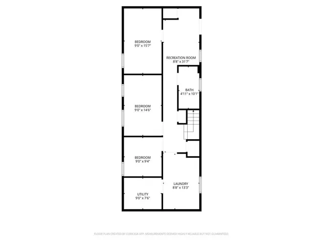 a picture of a bench in front of a wall