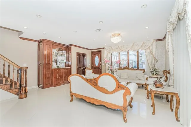 a very nice looking room with a large window and furniture