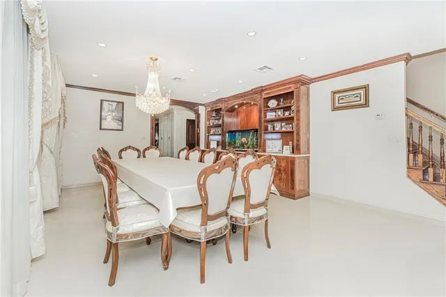 a dining room with furniture and window