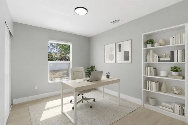 a workspace with furniture and a window