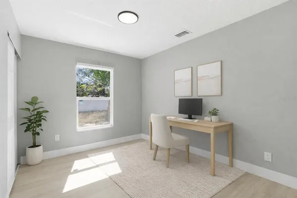 a workspace with furniture and a window