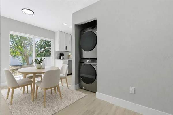 a dining room with furniture and wooden floor