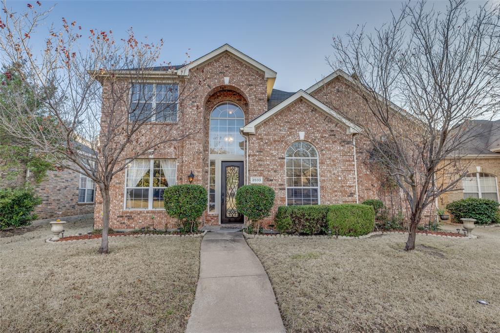 2033 Fox Glen Drive Allen, TX 75013 - Photo 1 of 1 a front view of a house with garden