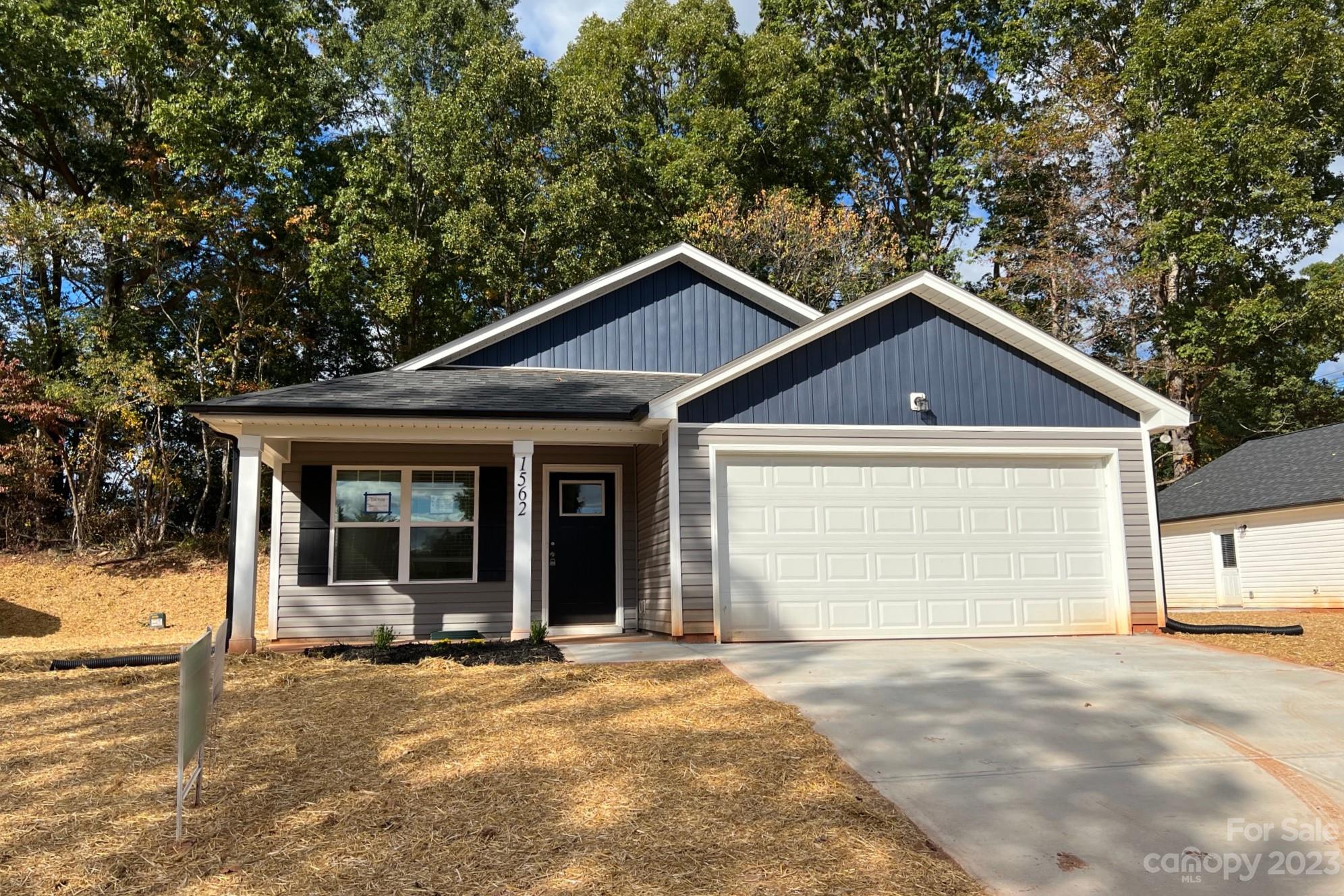 1562 17th Avenue Southwest Hickory, NC 28602 - Photo 1 of 21 a front view of a house with a yard and garage
