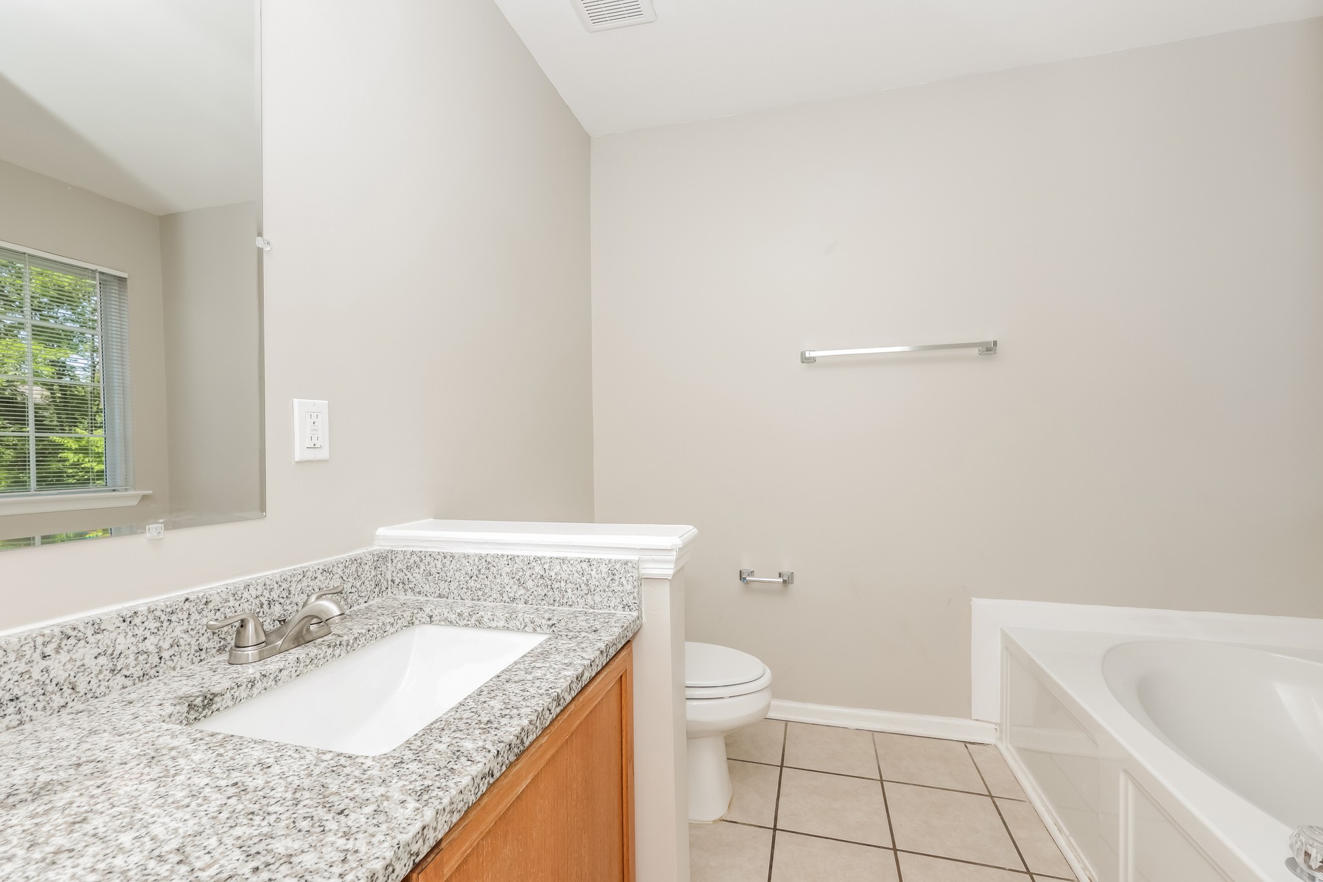 6104 Bentwood Drive Antioch, TN 37013 - Photo 12 of 17 a bathroom with a granite countertop sink a toilet and bathtub
