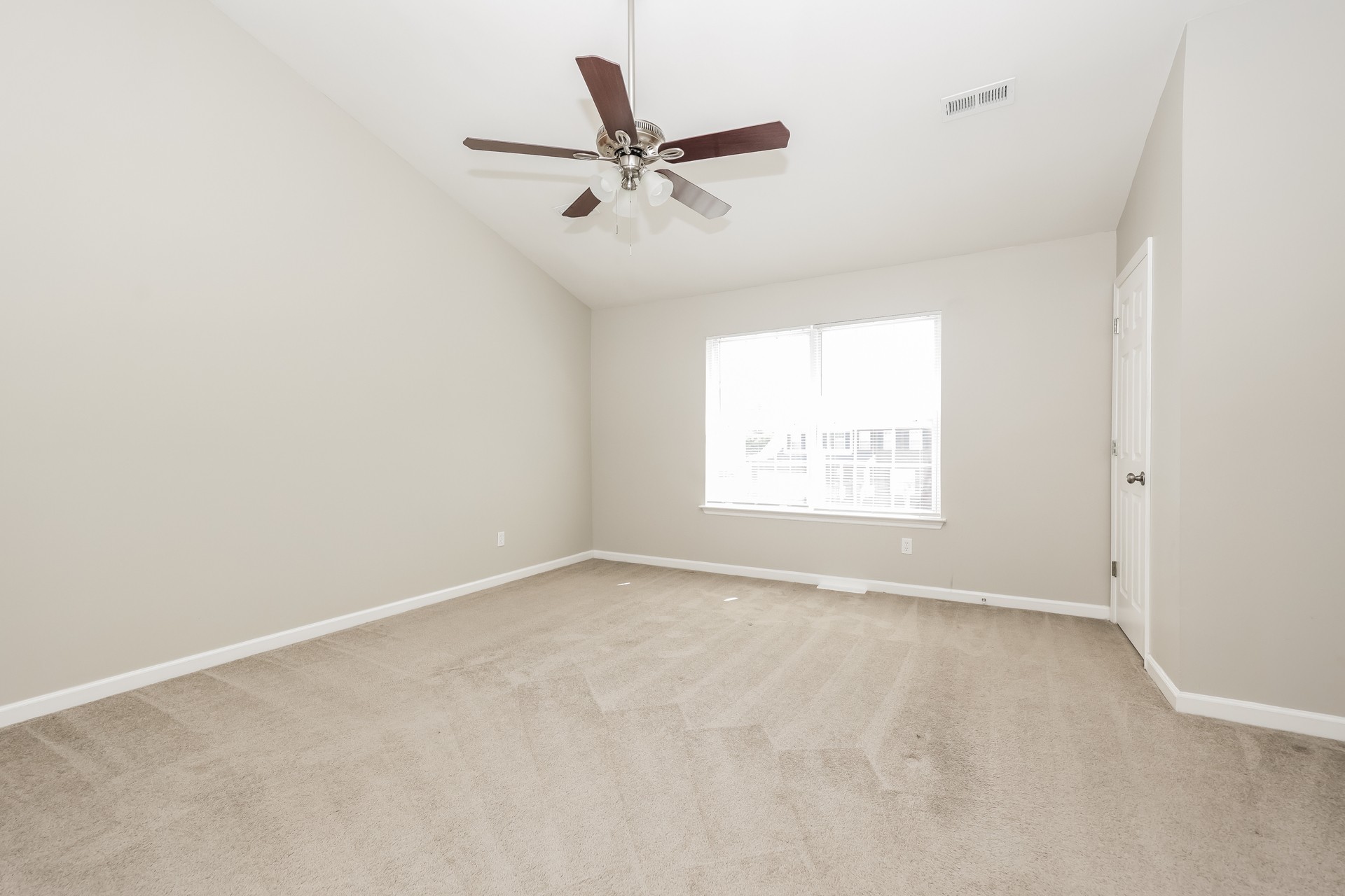 6104 Bentwood Drive Antioch, TN 37013 - Photo 13 of 17 an empty room with a window and a ceiling fan